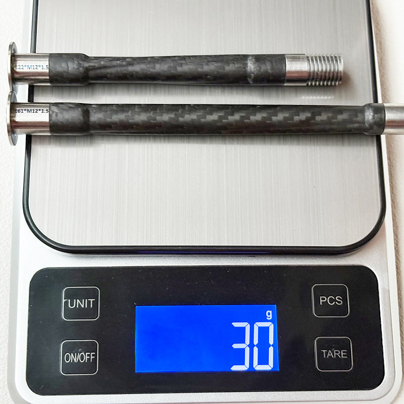 carbon thru axle 142x12 for MTB (close-up shot)  
 lightweight 30g carbon thru axle (whole product photo)