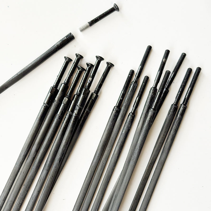 Carbon fiber spoke for road cycling - high tensile strength